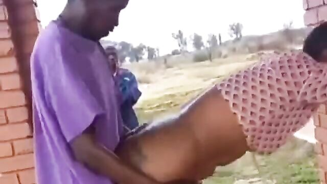 Mzansi man banging a thot doggy style in front of his friends on a public field - 4 image