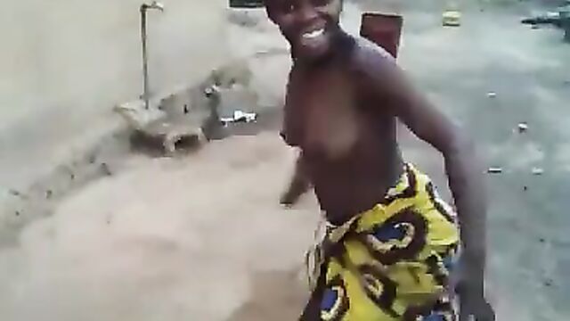African girl caught dancing with naked breasts in public