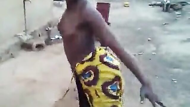 African girl caught dancing with naked breasts in public - 3 image
