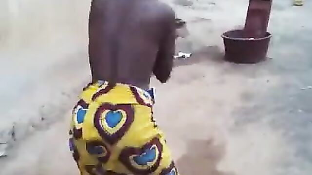 African girl caught dancing with naked breasts in public - 4 image