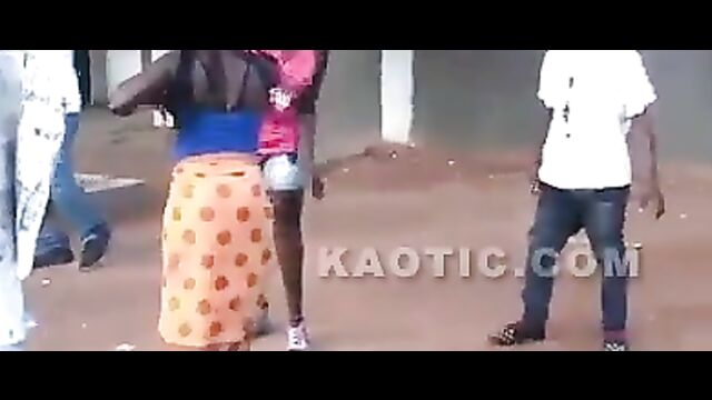 Black women fighting on the street, showing ass - 1 image