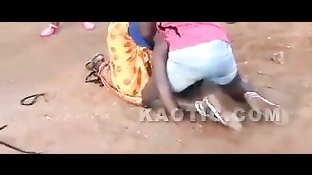 Black women fighting on the street, showing ass