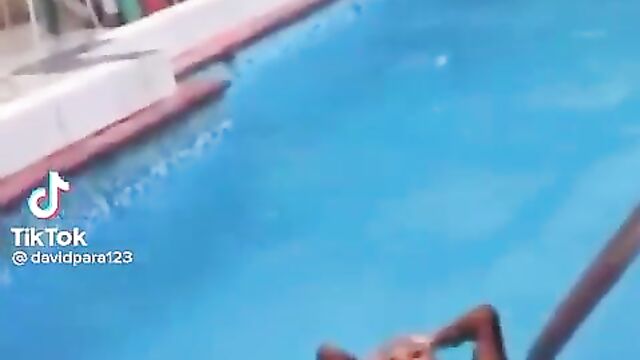 Boobs and nipple exposed in public as lady’s boob pops out in the pool - 1 image