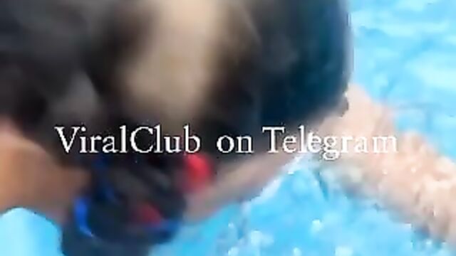 Girl showing breasts and wildin in the pool