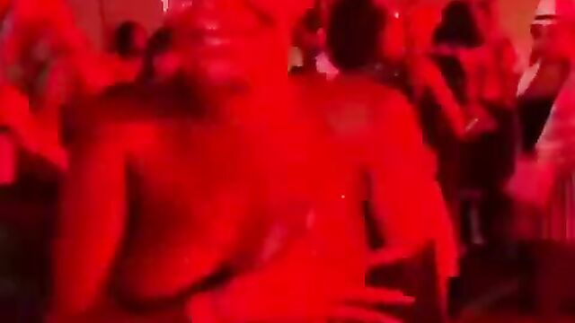 Naked Stripper Showing Her Breasts At A Public Party In Nigeria - 1 image
