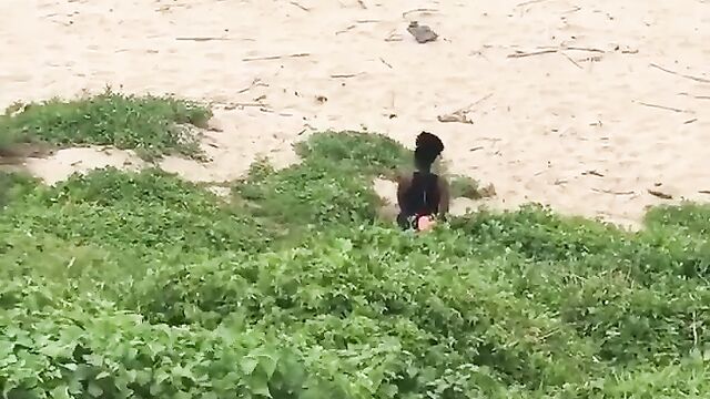Couple caught discreetly having sex in the bush by the beach side - 1 image