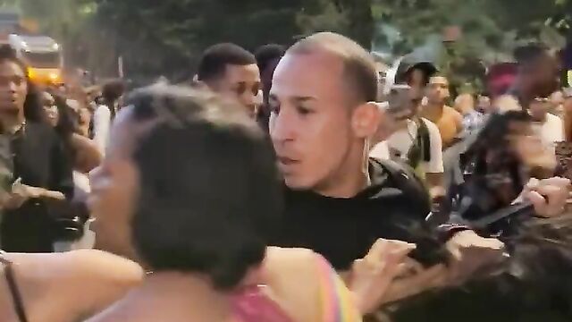Breasts pop out as woman beats up her husband’s side chick in public at a festival - 1 image