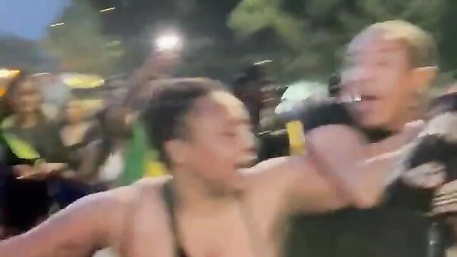 Breasts pop out as woman beats up her husband’s side chick in public at a festival - 3 image