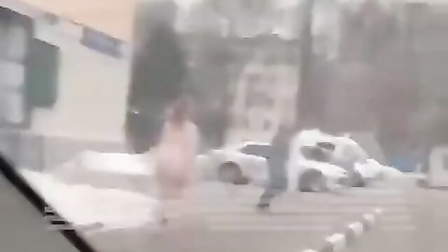 Naked woman caught running after police officer in Moscow, Russia