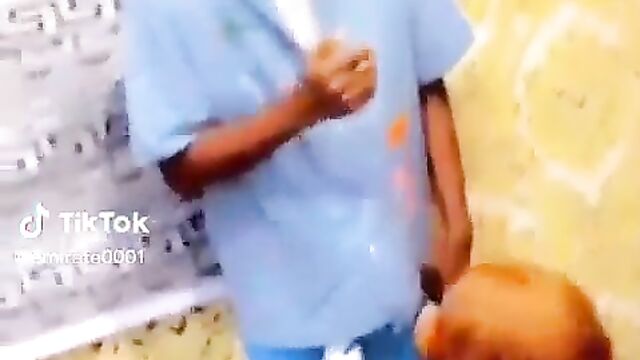 Nigerian girl giving blow job to boyfriend in public at a house party - 1 image