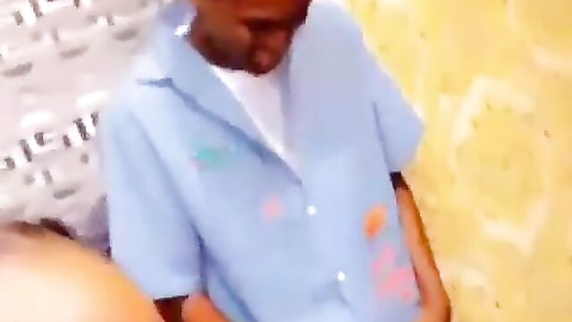 Nigerian girl giving blow job to boyfriend in public at a house party