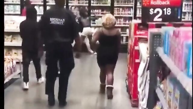Boobs out in Walmart as girls fight in public - 1 image