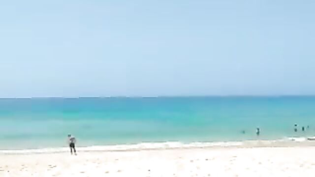 Naked couple caught having sex on floater board in the ocean - 1 image