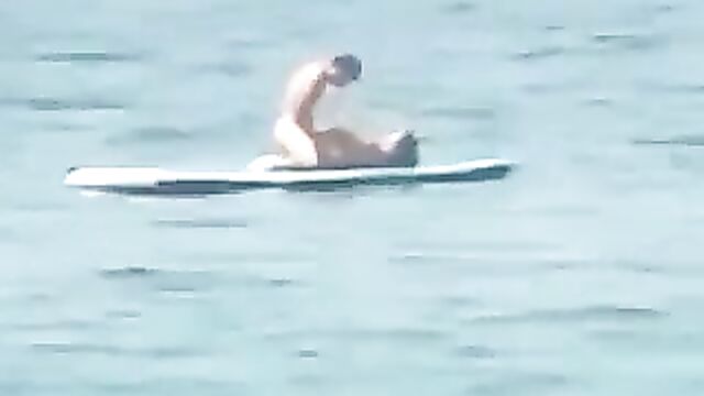 Naked couple caught having sex on floater board in the ocean - 5 image