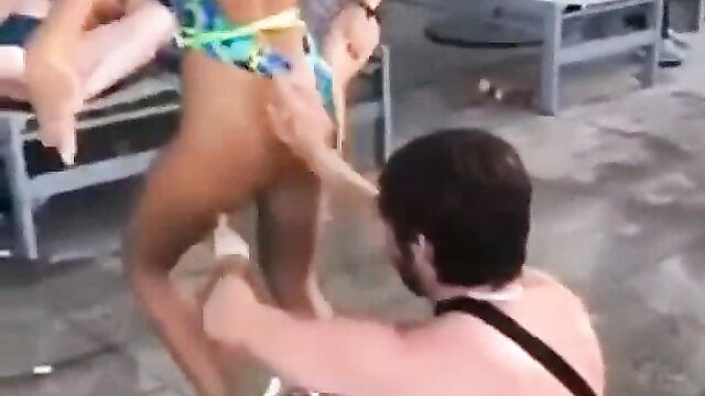 Eating ass while chilling around a pool