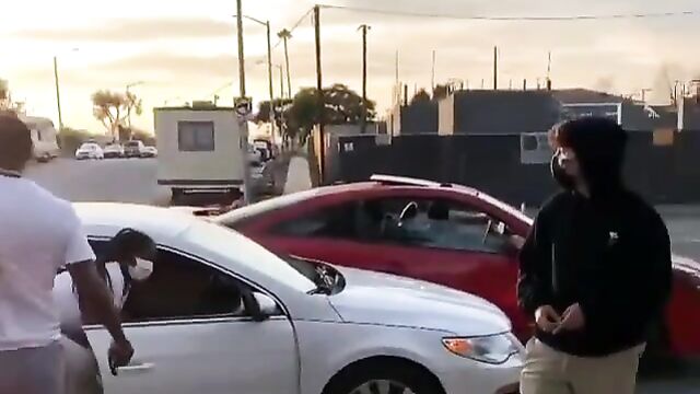 Big boobs fly out in public street fight - 1 image