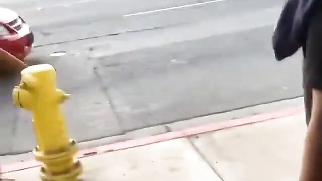Big boobs fly out in public street fight