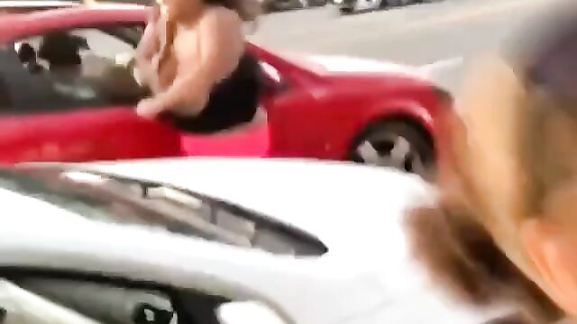 Big boobs fly out in public street fight - 3 image