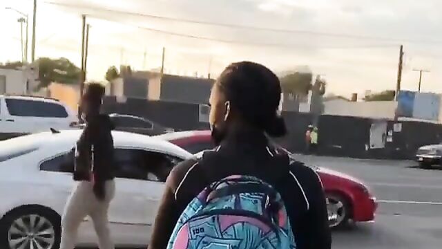 Big boobs fly out in public street fight - 5 image