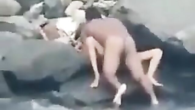 Naked couple caught having hot sex in public on the beach - 1 image