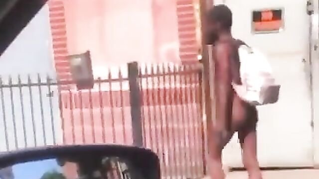 Man walks around NAKED in public with a bag on his back, after getting robbed and stripped! - 1 image