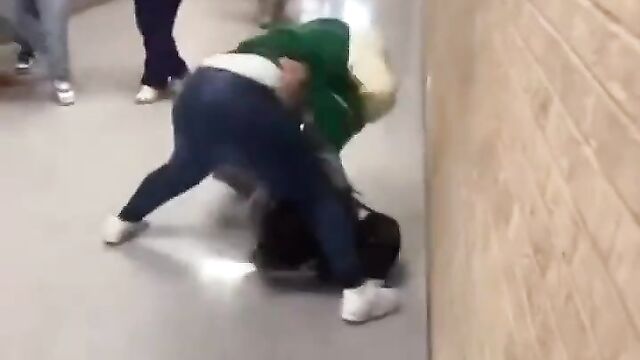 Lady’s boobs pop out while fighting