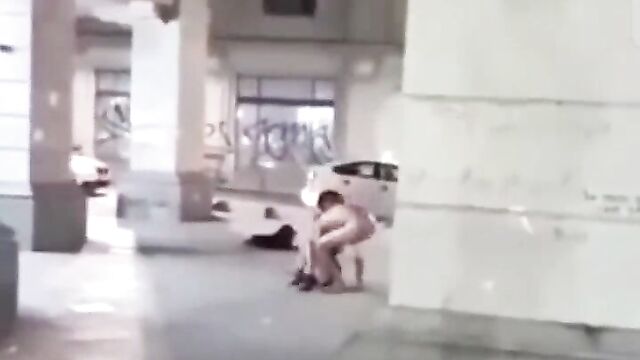 Drunk naked man and woman making out in public - 1 image