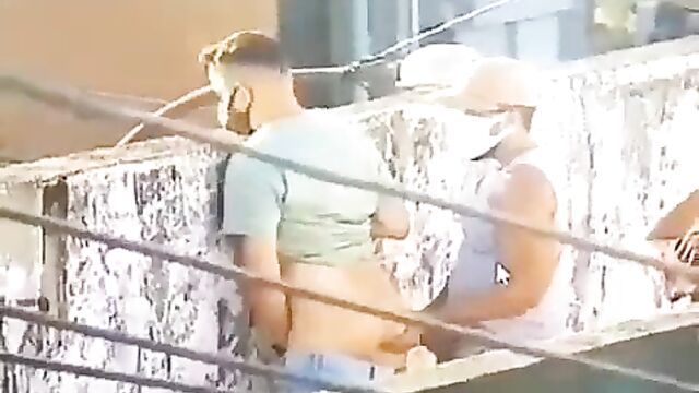 2 gays caught on camera doing it in public - 1 image