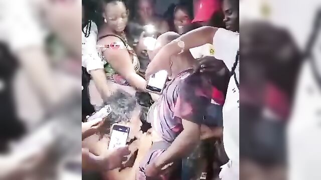 Naughty whore giving blowjob at a nightclub