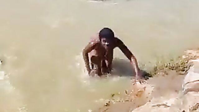 3 African ladies showing their breasts in a river - 3 image