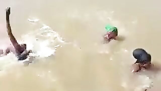 3 African ladies showing their breasts in a river - 4 image