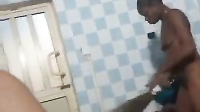Naked ashawo with slippers breasts doing house chores for her customer - 1 image