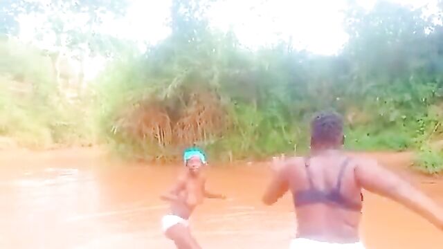 African girls showing their breasts in a river - 4 image