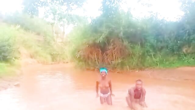 African girls showing their breasts in a river - 5 image