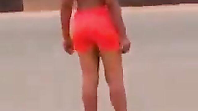 Lady strips and runs mad in Asaba, showing boobs in public - 1 image