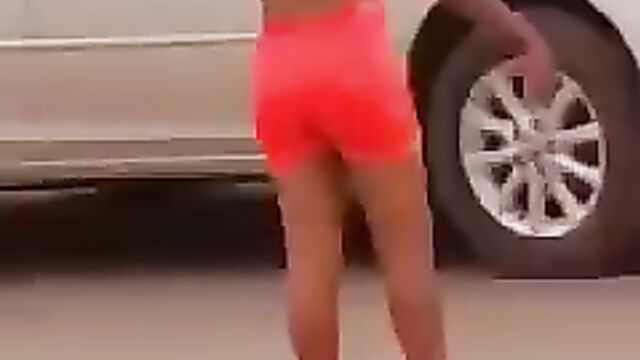 Lady strips and runs mad in Asaba, showing boobs in public - 4 image
