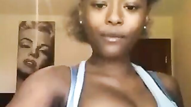 The Power of Boobs: Girl lifts a hanger with her nipple - 1 image