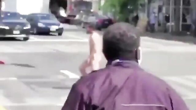 Naked man caught fighting and attacking people in public - 1 image