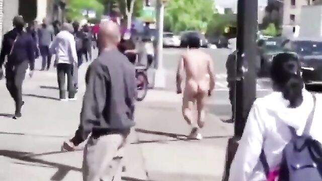 Naked man caught fighting and attacking people in public