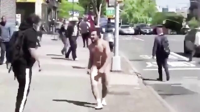 Naked man caught fighting and attacking people in public - 4 image