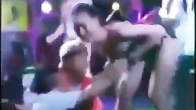 Wife beats husband with a frying pan after she caught him cheating with a stripper & touching her breasts in public - 1 image
