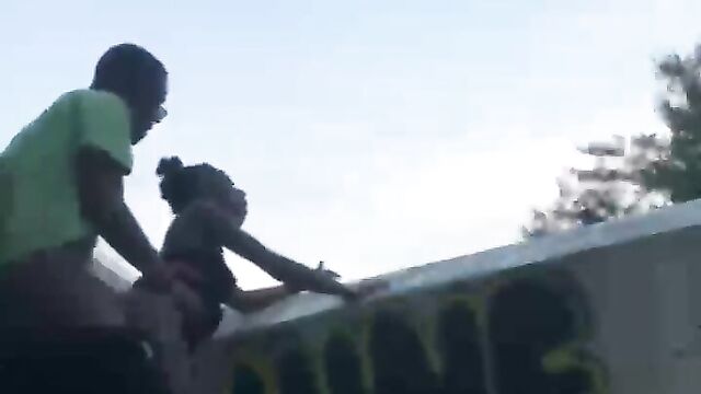 Couple caught having sex on a bridge in public