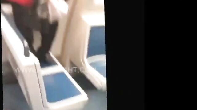 Woman fighting naked on a bus - 1 image
