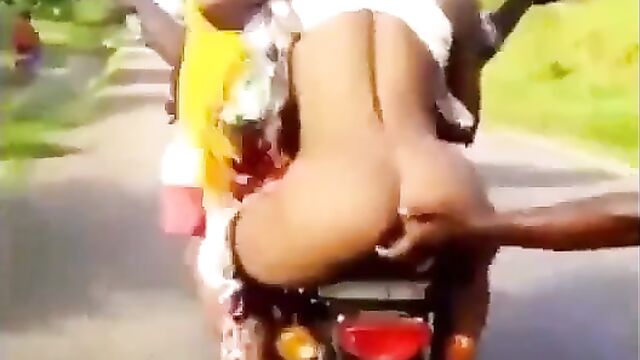 Prostitute with naked booty riding on a motorcycle - 4 image