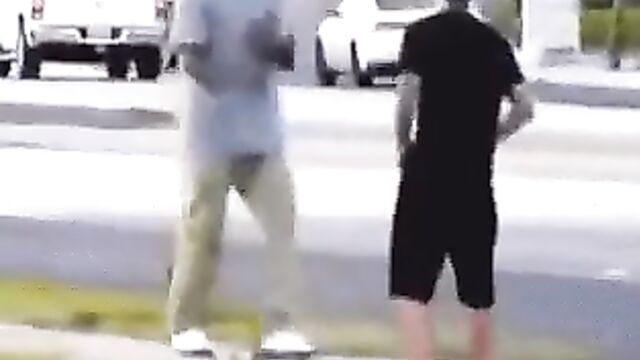 White dude strips naked in public to fight another man on the street - 1 image