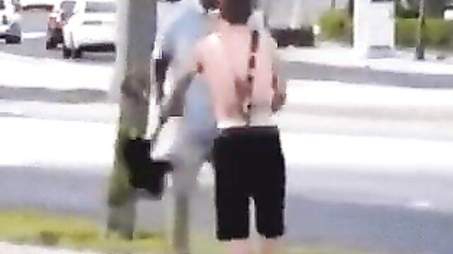 White dude strips naked in public to fight another man on the street - 4 image