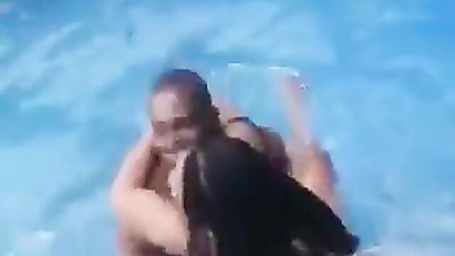 Horny couple having sex in a pool in public - 4 image