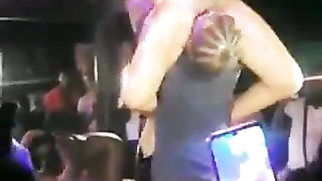 Naked stripper with big breasts and a thot entertaining guests at a club party by eating pussy in public - 1 image