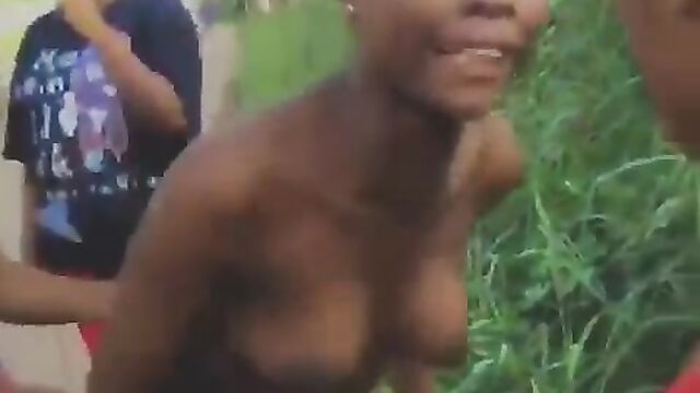 Boobs pop out as 2 Bini girls fight in public over boyfriend in Nigeria