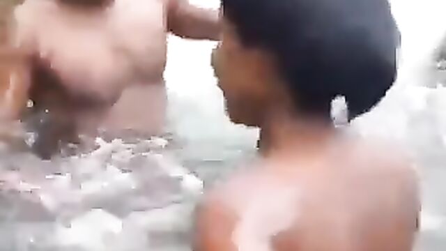 Topless ebony whore with naked breasts having fun with her boyfriend in a waterfall - 5 image